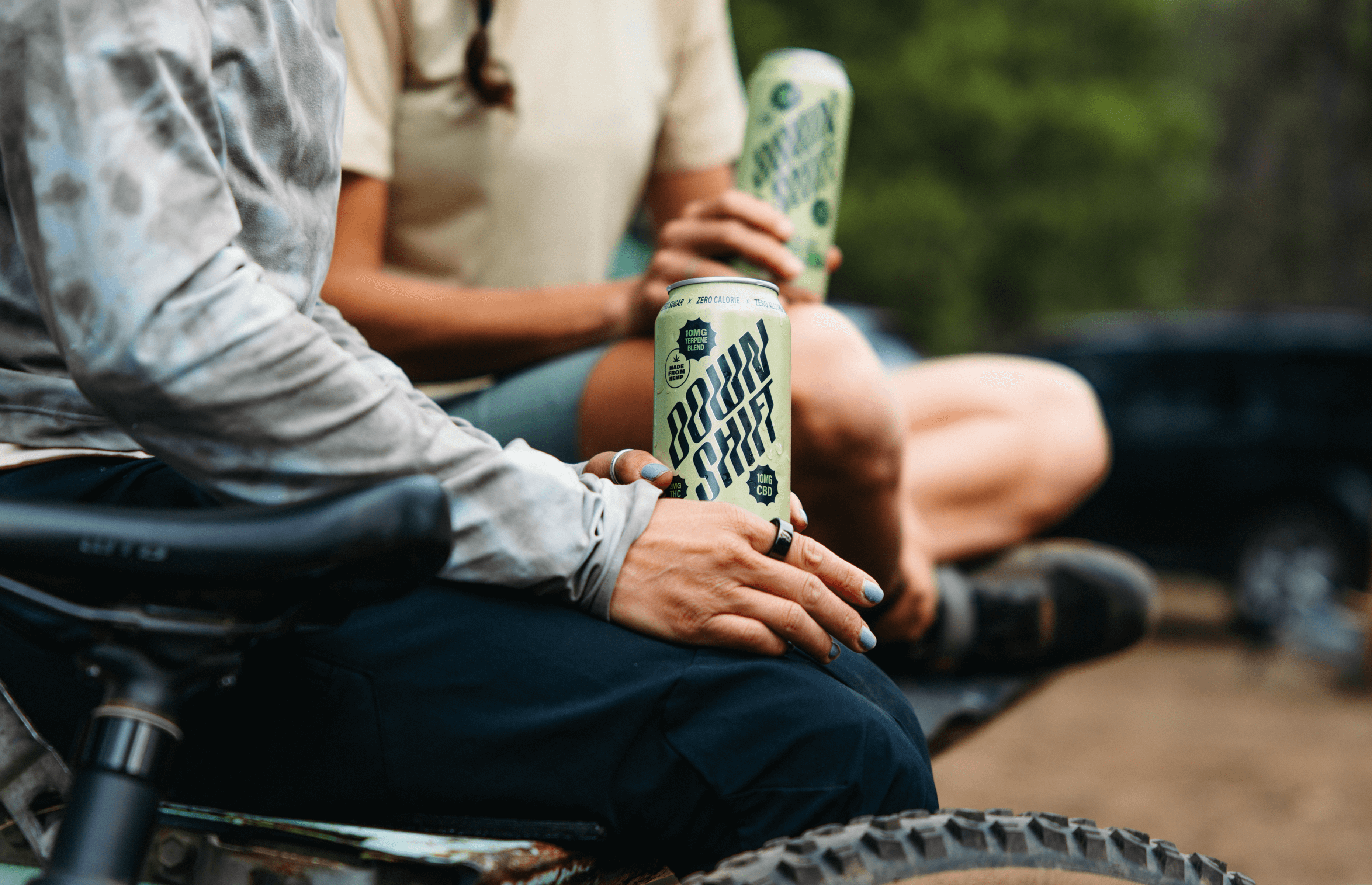 Down Shift Sitting Holding Cans
