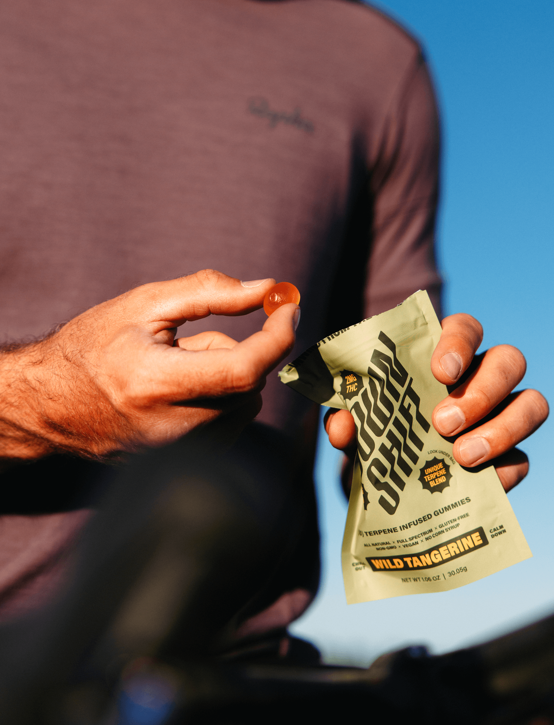 Down Shift Guy Holding Gummies